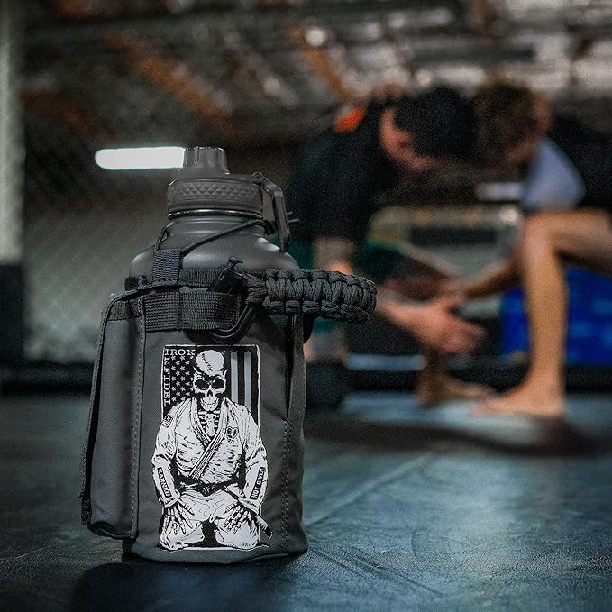 Iron Infidel Battle Bottle - Half Gallon Water Bottle Insulated, 64 oz Stainless Steel Water Jug with Handle - Gym Water Bottle for Men with Rugged Sleeve for Storage (Earned, Not Given 2 Liter)